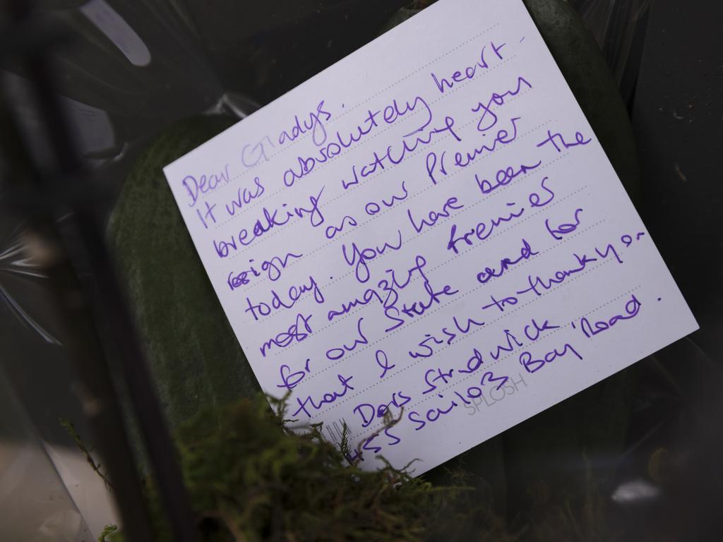 A note is seen on flowers left at the Sydney home of Gladys Berejiklian. Picture: Brook Mitchell/Getty Images