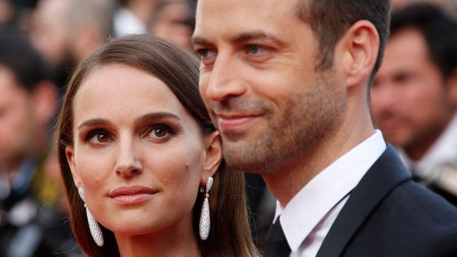 (FILES) US-Israeli actress and director Natalie Portman (L) and her husband French choreographer Benjamin Millepied pose as they arrive for the opening ceremony of the 68th Cannes Film Festival in Cannes, southeastern France, on May 13, 2015. Portman has divorced Millepied, US media reported on March 8, 2024. The "Black Swan" star filed last July to end her marriage of 11 years to Millepied, People magazine said. The divorce was finalized in France last month, it said, citing a Portman representative. (Photo by Valery HACHE / AFP)