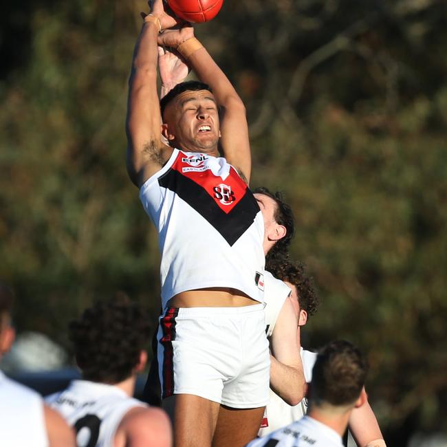 South Belgrave’s Elliot Triegaardt flies for a grab on Saturday. Picture: Stuart Milligan