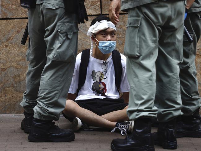 Riot police detain a protester. Picture: AP