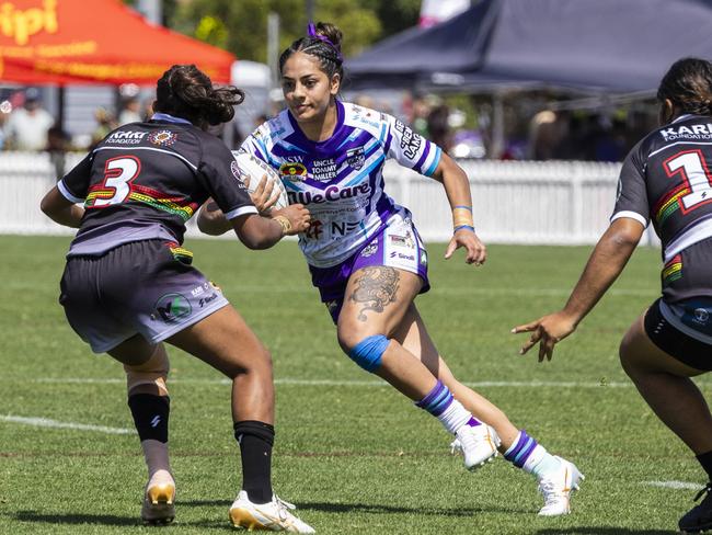 Evah McEwen runs the ball during the U17s girls Koori Knockout grand final. Picture: Andrea Francolini