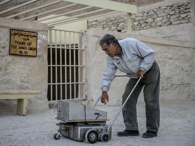 Deep scan ... Japanese expert Hirokatsu Watanabe checks his radar equipment outside King Tutankhamun's burial chamber in the Valley of Kings near Luxor in southern Egypt. Source: AFP