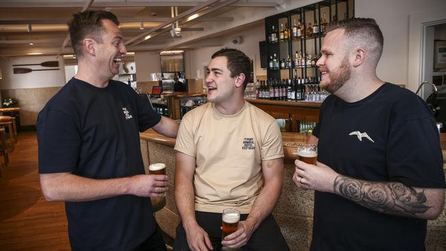 The new Port Admiral Hotel co-owners Crispian Fielke, Angus Henderson and Stewart Wesson in the front bar. Picture: AAP / Mike Burton