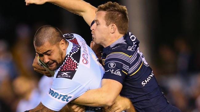 Michael Morgan jumps on Andrew Fifita’s back.