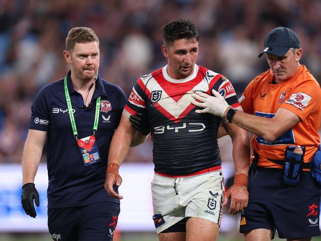 SYDNEY, AUSTRALIA - MARCH 06:  VictorÃÂ Radley of the Roosters is attended to by trainers after a head clash with James Tedesco of the Roosters during the round one NRL match between Sydney Roosters and Brisbane Broncos at Allianz Stadium on March 06, 2025, in Sydney, Australia. (Photo by Cameron Spencer/Getty Images)