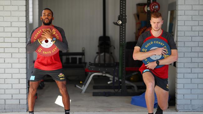 Gold Coast Suns AFL players Touk Miller and Peter Wright train at their home. (Photo by Chris Hyde/Getty Images)