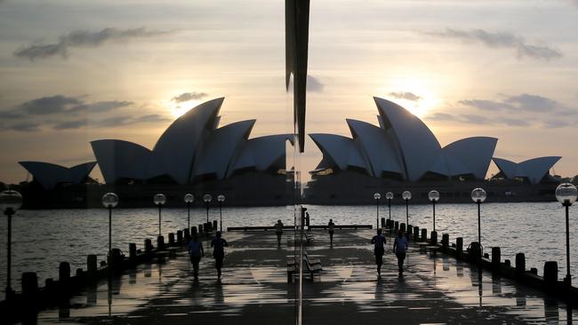 A wet Sydney Opera House sunrise is still magnificent