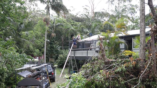 Clean up on Mt Tamborine. Locals helping locals recover. Picture Glenn Hampson