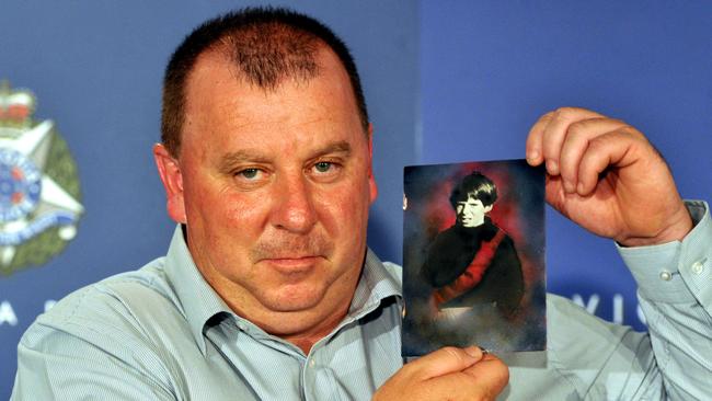 Daryl Floyd holds a photo of his brother Terry at the Victoria Police Centre. Picture: Julian Smith