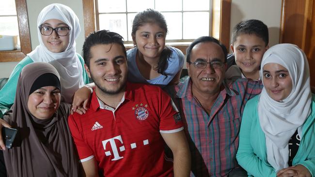 Hicham (third left) with family Marwa, 15, Alma, 8, Homam, 11, Khadija, Mukhtar and Shirin, 17. Photo: Tim Clapin.
