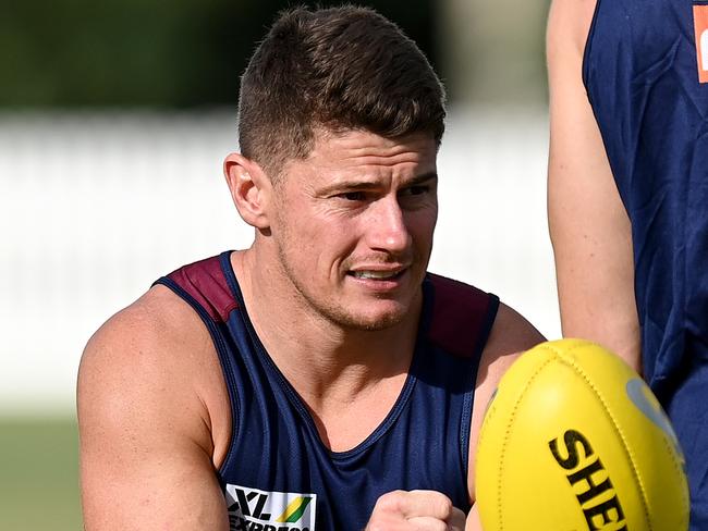 BRISBANE, AUSTRALIA - FEBRUARY 17: Dayne Zorko handballs during a Brisbane Lions AFL training session at Leyshon Park on February 17, 2021 in Brisbane, Australia. (Photo by Bradley Kanaris/Getty Images)