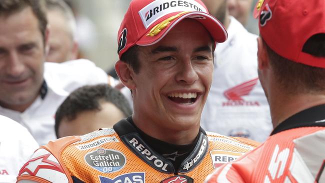 Marc Marquez is congratulated by Andrea Dovizioso, of Italy, after qualifying on the pole.