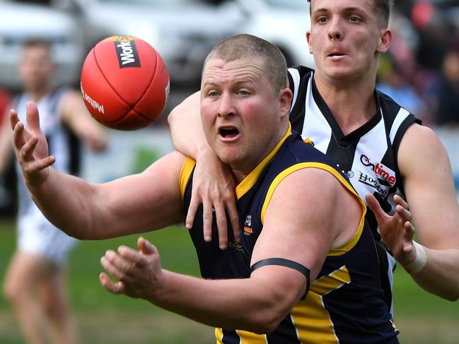 Nick Grigg (left) of Rubertswood is seen in action during the RDFL grand final, Sunbury, Sunday, September 15, 2019. RDFL footy grand final: Rupertswood v Wallan. (AAP Image/James Ross) NO ARCHIVING