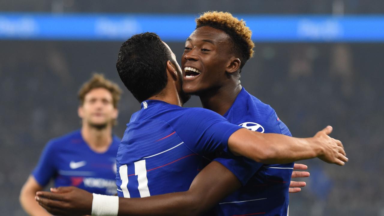 Chelsea's Callum Hudson-Odoi celebrates with teammate Pedro after his cross set up the Blues’ winning goal.