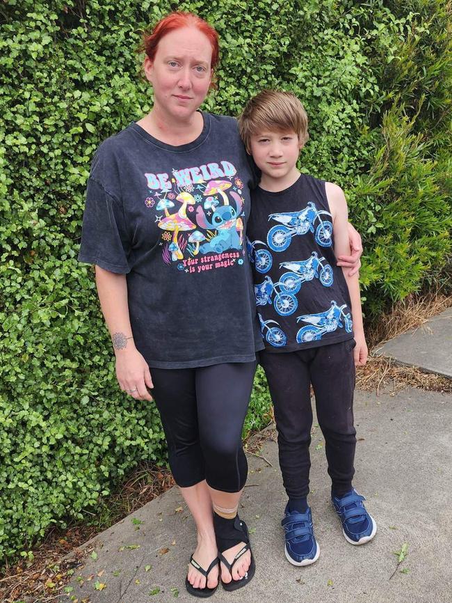 Amy Dudfield, with her foot in a brace, and her son Sam. Amy was trapped in the closing door of a train on the Gawler line. Picture: Supplied