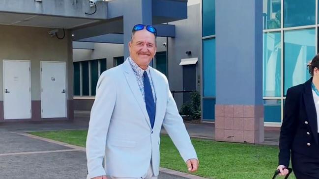 Robert Malcolm Lawson, 58, who has pleaded not guilty to raping a woman while she was asleep in her bed, leaves Cairns District Court with his legal counsel. Picture: Bronwyn Farr