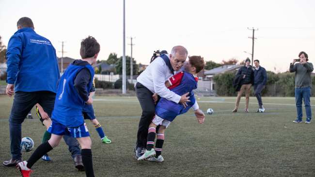 Prime Minister Scott Morrison crashed into the eight-year-old during his training at the Devonport Strikers Soccer Club in the electorate of Braddon on Wednesday night. Picture: Jason Edwards