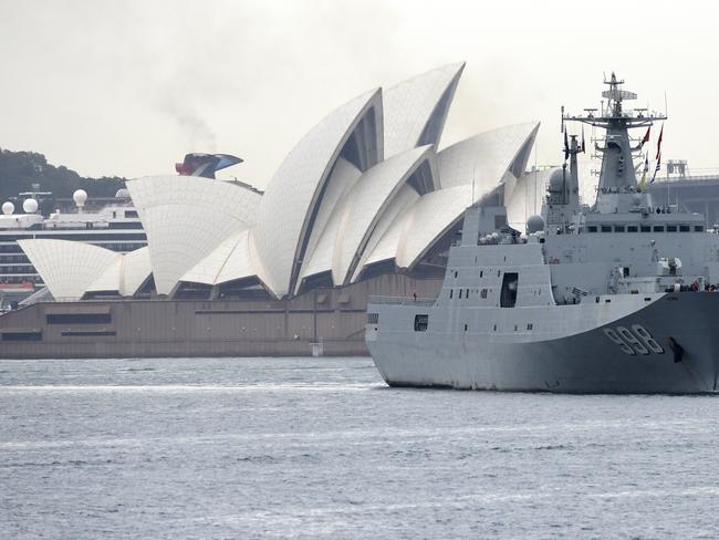 The Sydney Opera House can be seen as a Chinese Navel ship departs the Garden Island Naval Base in Sydney, Friday, June 7, 2019. Three Chinese Navy ships made a surprise four-day visit to Sydney, with Australian Prime Minister Scott Morrison saying it was a reciprocal visit after Australian naval vessels visited China. (AAP Image/Bianca De Marchi) NO ARCHIVING