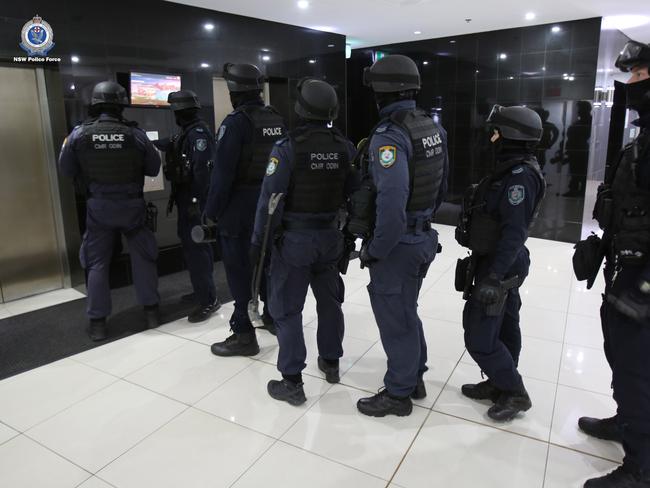 Strike force police prepare to raid the apartment. Picture: NSW Police