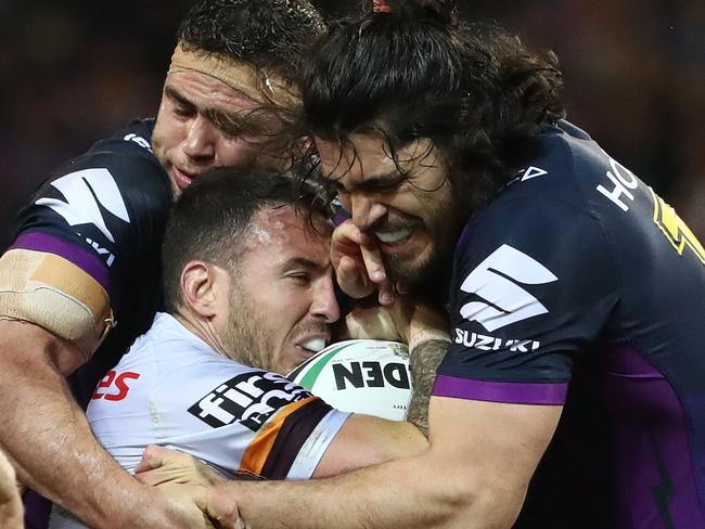 MELBOURNE, AUSTRALIA - SEPTEMBER 22:  Darius Boyd of the Brisbane Broncos is tackled by Dale Finucane and Tohu Harris of the Storm during the NRL Preliminary Final match between the Melbourne Storm and the Brisbane Broncos at AAMI Park on September 22, 2017 in Melbourne, Australia.  (Photo by Robert Cianflone/Getty Images)