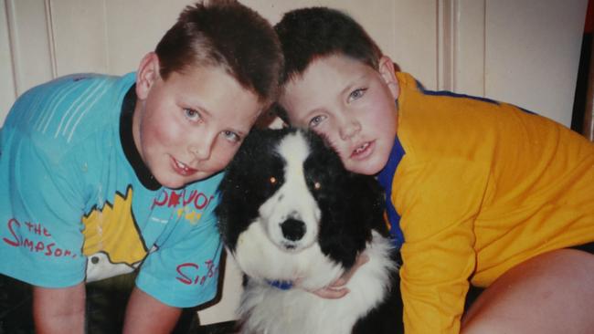 Murder victim, Robert Atkins, right, with his brother Joel and dog Jess. Robert was about eight years old in this photo. Picture supplied.