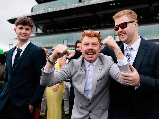 Racegoers celebrating a win