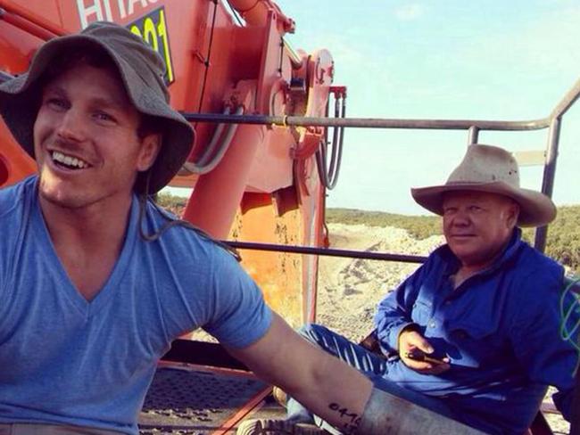 David Pocock and farmer Rick Laird attach themselves to an excavator at the Maules Creek coal mine, shortly before being arrested. Pocock pleaded guilty but no conviction was recorded. Picture: Twitter