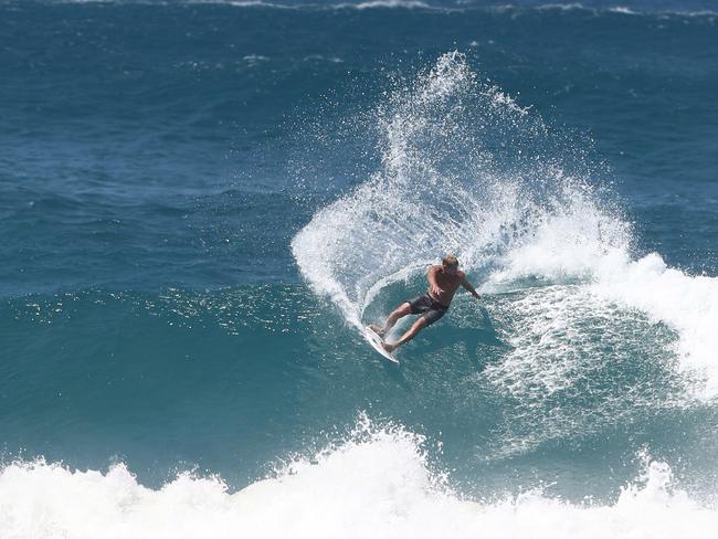 Mick Fanning rides a wave at Kirra during the large swell produced by Cyclone OMA. Photograph : Jason O’Brien.