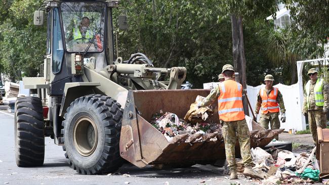 Defence Force Personel assist with the clean up in Lismore in the aftermath of the devastating floods. Picture: Jason O'Brien