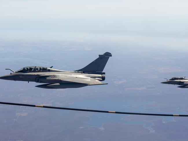 A French Rafale jet refuels mid-air about 100km south of Darwin. Picture: Floss Adams.