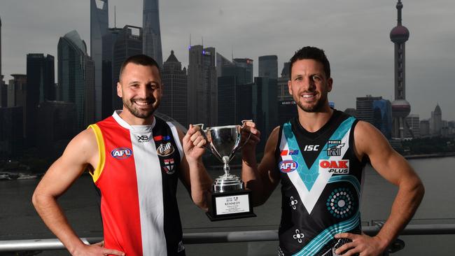 Saints captain Jarryn Geary and Port’s Travis Boak in Shanghai China. Picture: AAP Image/David Mariuz