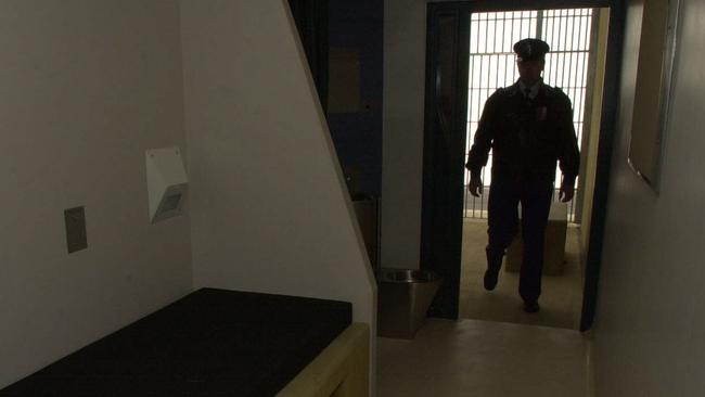 Correctional Services Officer checks a cell in the high-risk management unit at Goulburn Jail 31/10/01. Pic Chris Pavlich. NSW / Prison / Interior