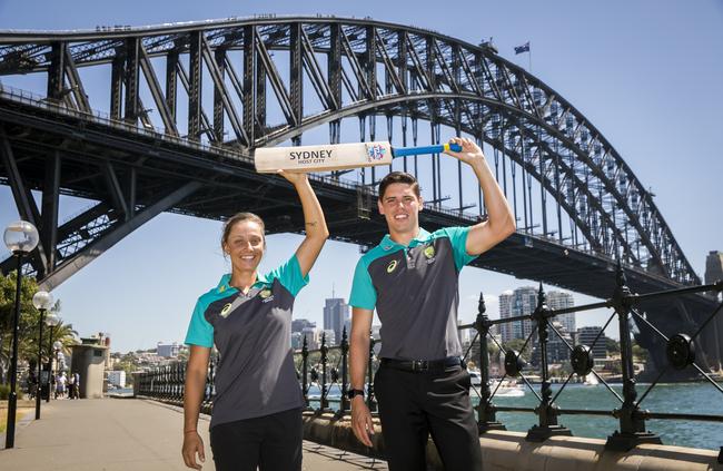 Cricketers Ash Gardner and Ben Dwarshuis celebrating Sydney being named the host city for the 2020 World T20 tournament. Picture: Anna Kucera