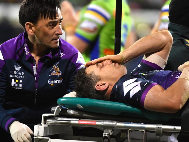 Billy Slater of the Storm is carried off after being knocked out during the Round 20 NRL match between the Canberra Raiders and the Melbourne Storm at GIO Stadium in Canberra, Saturday, July 22, 2017. (AAP Image/Mick Tsikas) NO ARCHIVING, EDITORIAL USE ONLY