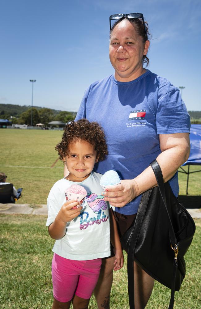 Reyna Hippi (left) and Roxanne Duncan enjoy cool snow cones at the Warriors Reconciliation Carnival at Jack Martin Centre, Saturday, January 25, 2025. Picture: Kevin Farmer