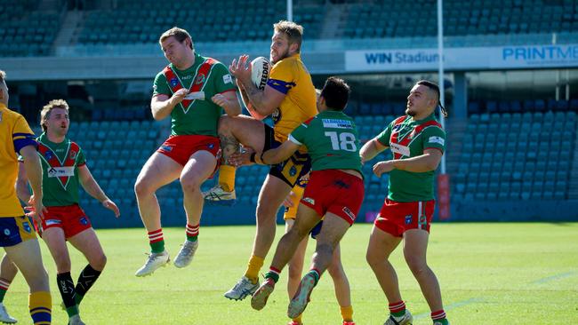 Corrimal Vs Dapto. Aaron Gray wins the challenge for the high ball. Picture: Thomas Lisson