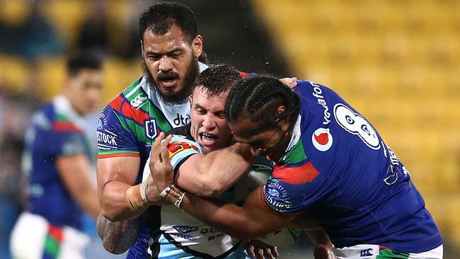 Kurt Capewell is tackled by Warriors props Agnatius Paasi and Leeson Ah Mau. Picture: Getty Images