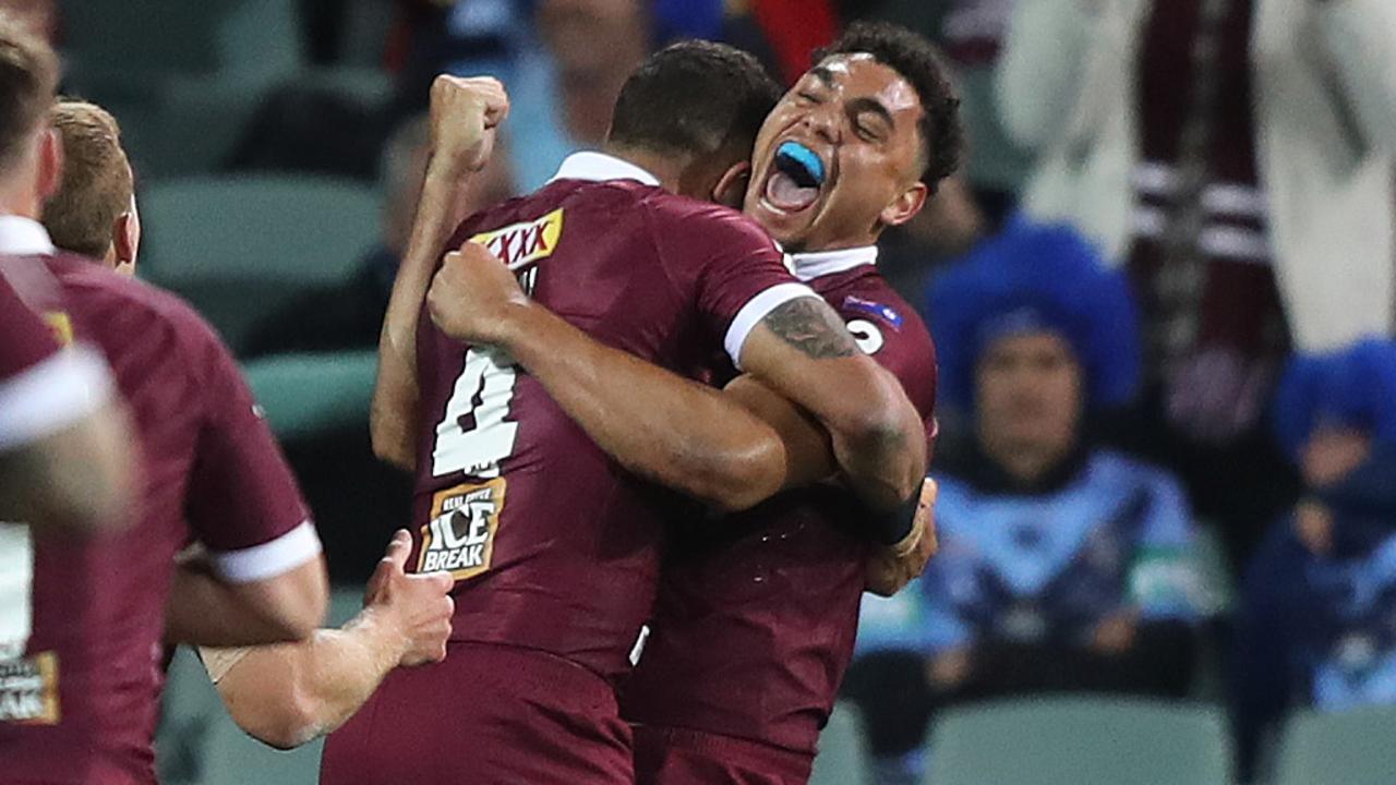 QLD's Xavier Coates scores a try.