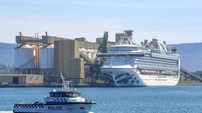 Water police patrol the contaminated cruise ship Ruby Princess while it berths in Port Kembla south of Sydney, NSW, as crew members undergo questioning over the coronavirus outbreak. Picture: Simon Bullard