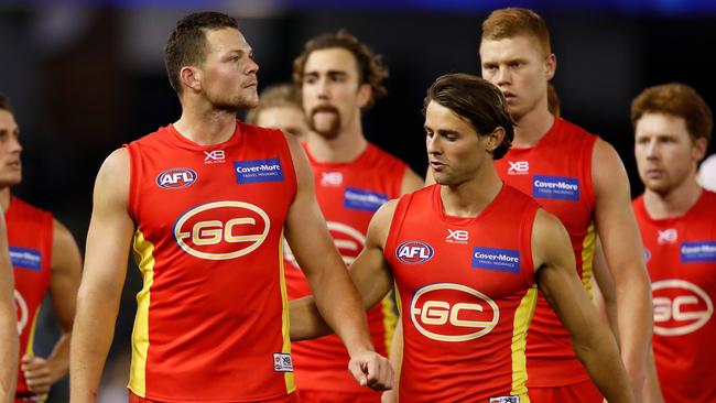 The Suns look dejected. (Photo by Adam Trafford/AFL Media/Getty Images)