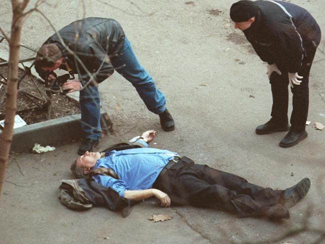 Police photograph the body of assassinated Liberal Russia party leader Sergei Yushenkov outside his Moscow apartment. Picture: File