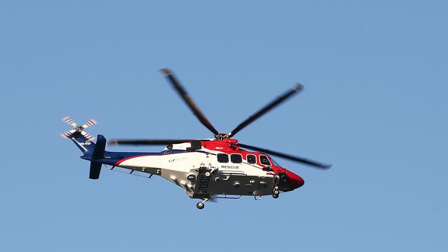 The Queensland Government backed QGAir Rescue 510 Helicopter is headed to the crash at Mulgrave River bridge, Gordonvale. PICTURE: BRENDAN RADKE