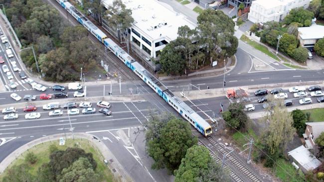 Before: traffic banked up either side of the Toorak Rd Kooyong level crossing.