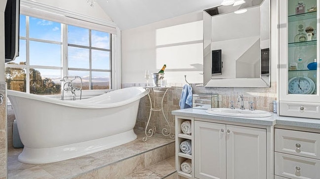 A glam bathroom where you can soak in a tub.