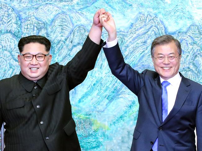 North Korean leader Kim Jong-un and South Korean President Moon Jae-in pose for photographs after signing the Panmunjom Declaration for Peace, Prosperity and Unification of the Korean Peninsula. Picture: Getty