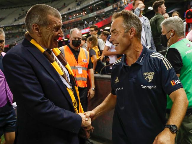 MELBOURNE, AUSTRALIA - MARCH 20: Jeff Kennett and Alastair Clarkson, Senior Coach of the Hawks (right) shake hands after the 2021 AFL Round 01 match between the Essendon Bombers and the Hawthorn Hawks at Marvel Stadium on March 20, 2021 in Melbourne, Australia. (Photo by Michael Willson/AFL Photos via Getty Images)