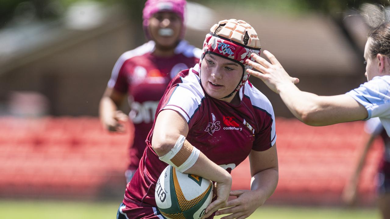 Queensland Reds Taleah Ackland looks for an off-load against the NSW Waratahs during the Next Gen 7s series at Toowoomba Sports Ground. Picture: Kevin Farmer