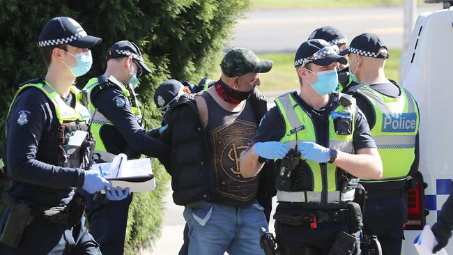 Victoria Police arrest a protester outside the Shrine. Picture: Alex Coppel