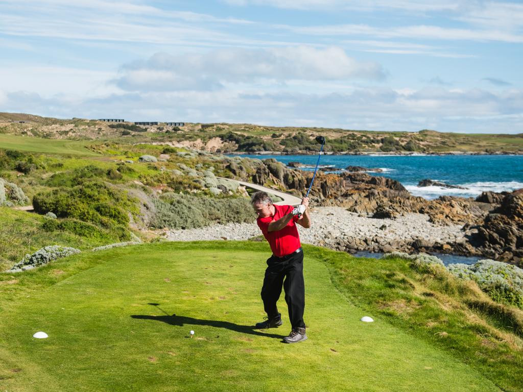 A golfer tees off on the world-class Cape Wickham Golf Course in Tassie’s King Island. Picture: Tourism Tasmania