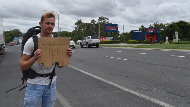 British backpacker Ross Millen is trying everything he can to get to Mackay after his bus heading to Airlie Beach stopped in Rockhampton due to a major rain event in Queensland's north.